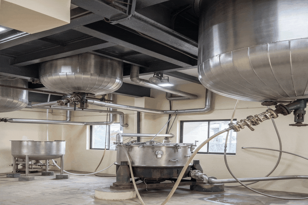 Modern chemical manufacturing facility with stainless steel reactors and process equipment